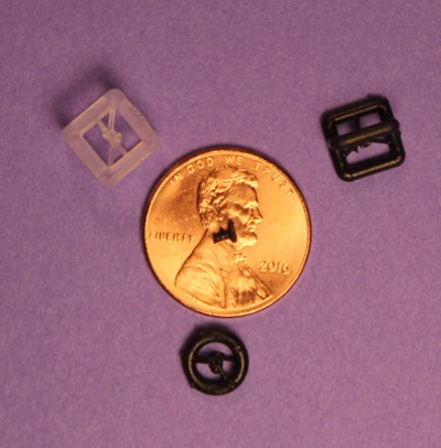This is a size comparison between 3-D printed prosthesis implant and a penny