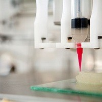 3-D printer in Weill Hall deposits cells encapsulated in a hydrogel that will develop into new ear tissue