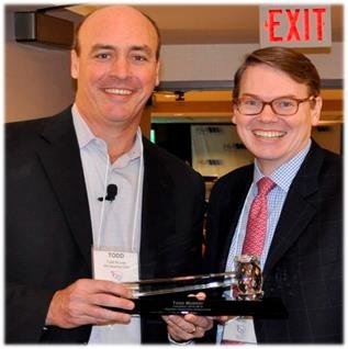 Outgoing HIA Chairman Todd Murray, accepts a Ceremonial Gavel from incoming Chairman Scott Davis