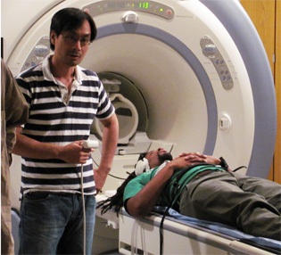 NIDCD researcher Ho Ming Chow with rapper Mike Eagle