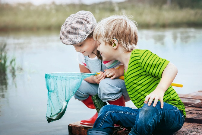 Children with a fish in a net