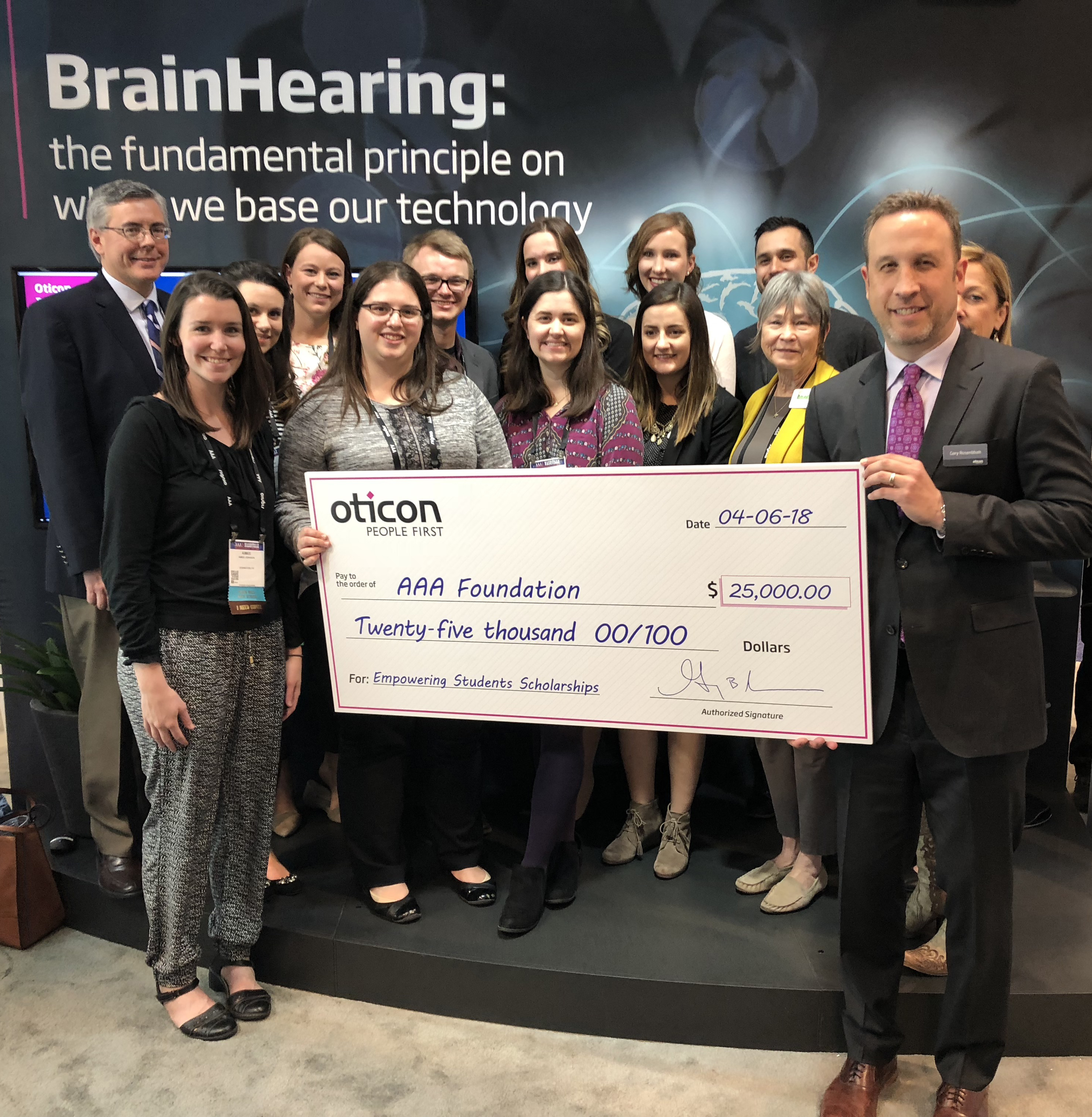 Oticon President Gary Rosenblum presented a $25,000 donation