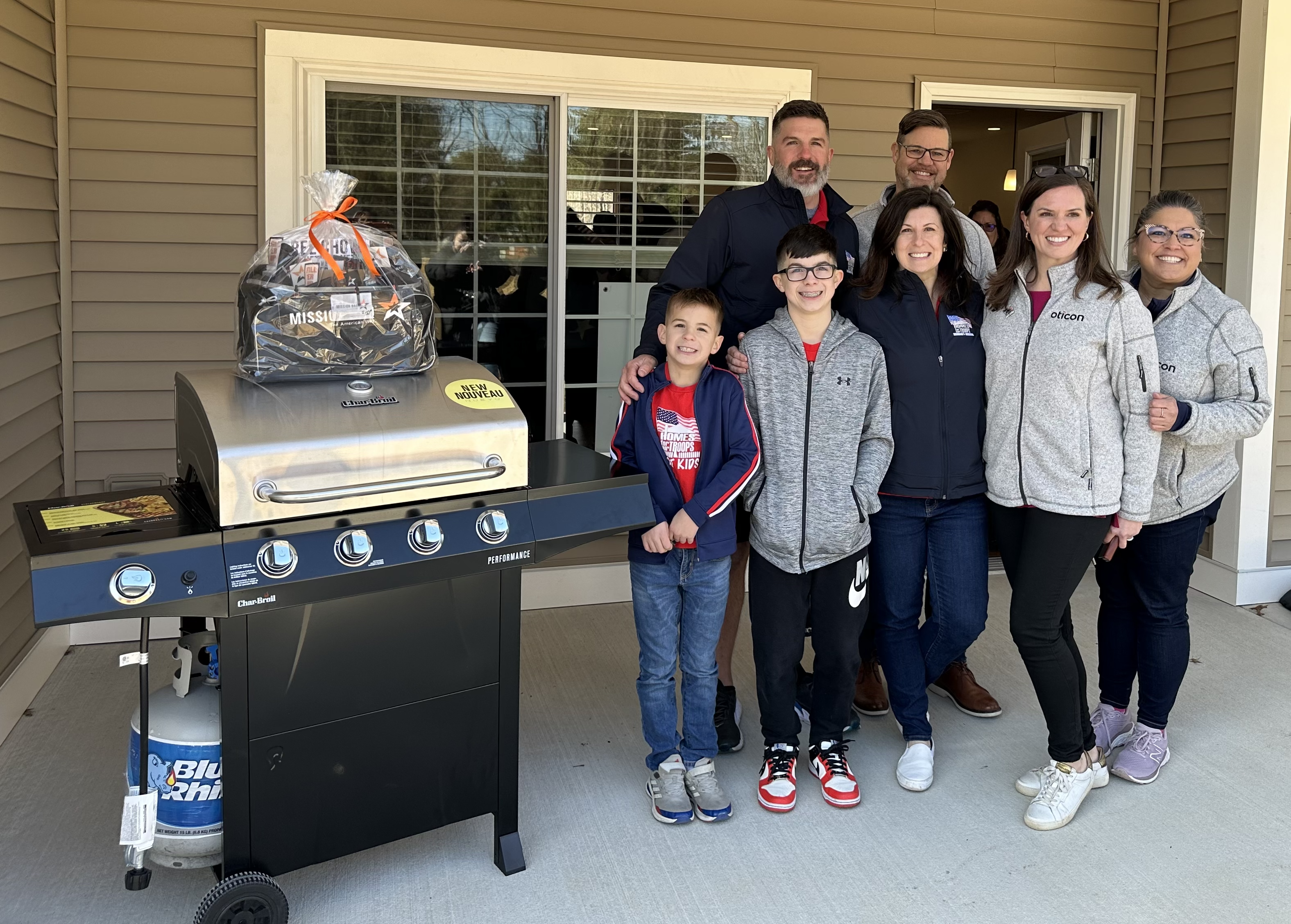 The Lasko family and Oticon Government Services Team members