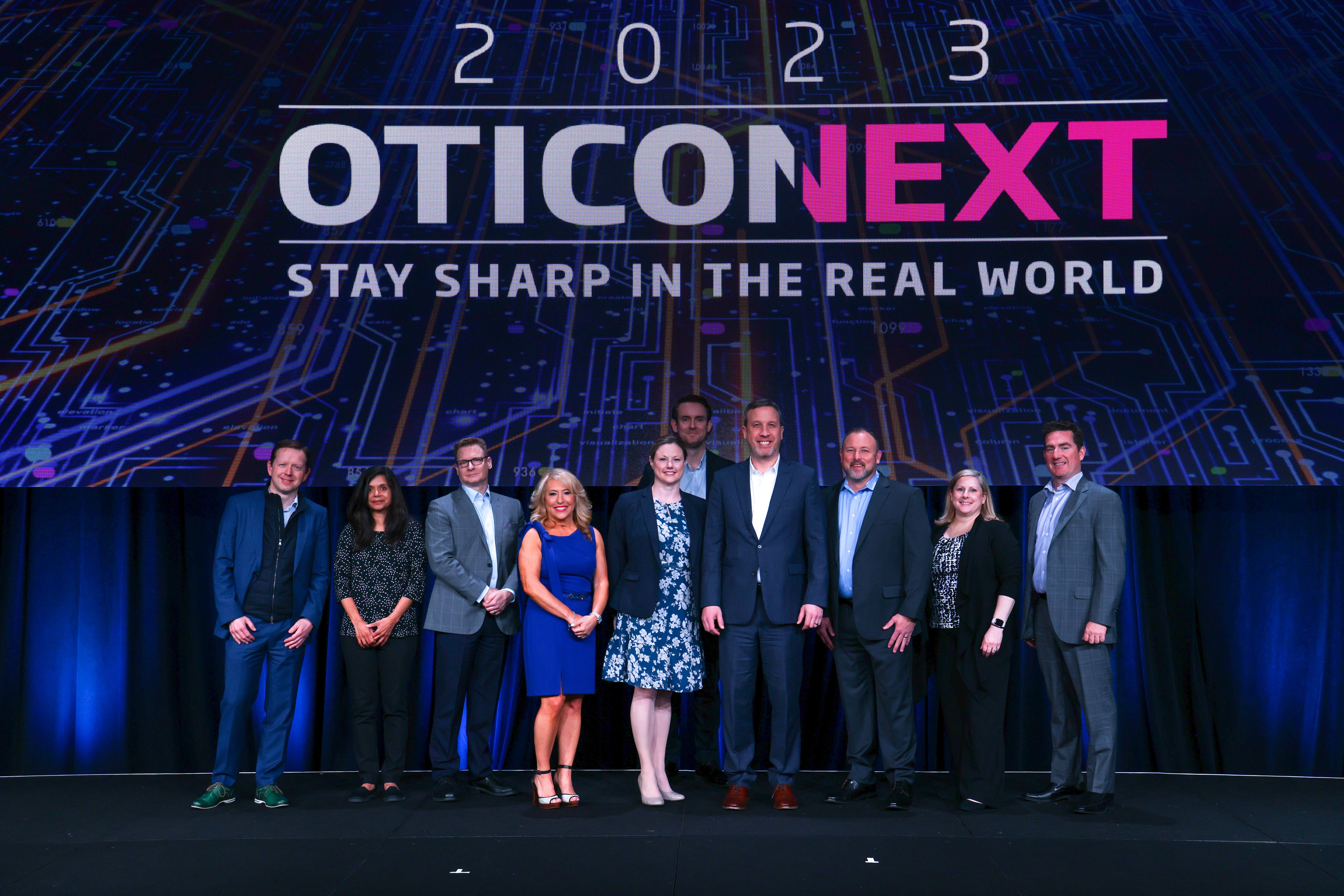 A group of people standing on a stage