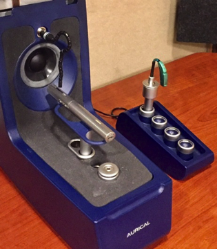 Roger Pen microphone was placed inside the HIT box and the Phonak Sky hearing aid was mounted on the external coupler for measurement