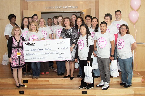  Joy Simha accepted the donation from Oticon at a special Breast Cancer & Hearing Health Awareness &ldquo;Pink Day&rdquo; at Oticon Headquarters