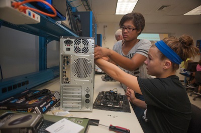 Campers at last year’s RIT/NTID TechGirlz camp work on building their own computers to take home