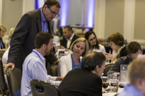 Participants and Unitron team collaborating re: marketing to the new consumer