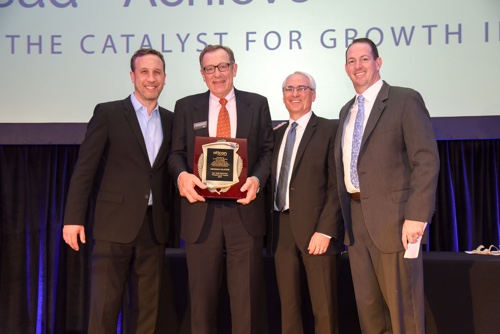 Oticon President Gary Rosenblum presents the 2017 Ken Saiki People First Award to Henning Falster