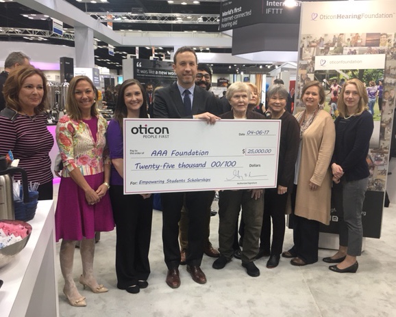 Oticon President Gary Rosenblum presented a $25,000 donation