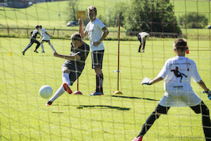 Simon Ollert and young soccer players
