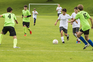 Simon Ollert and young soccer players