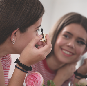 Woman applying mascara