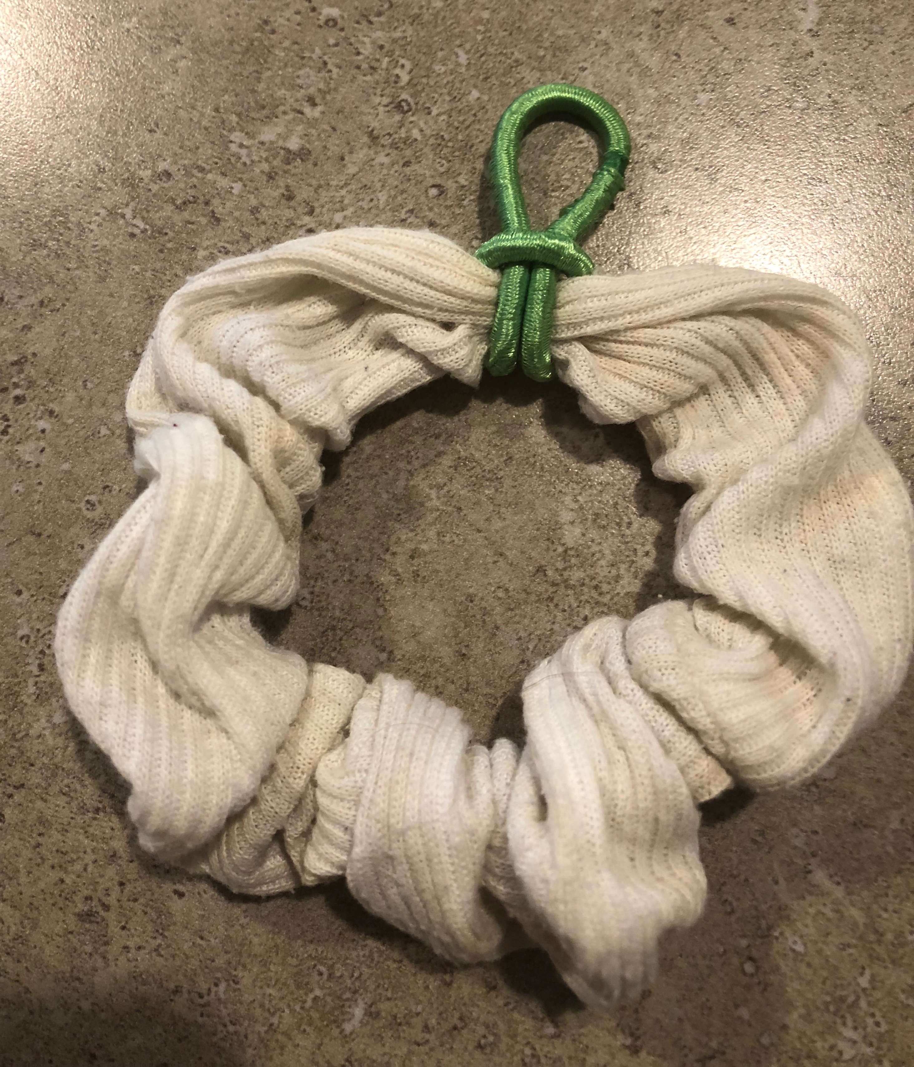 Do it yourself handwriting aid made from hair scrunchy and hair band