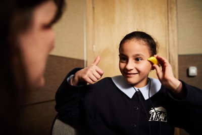 little girl, Isra, with hearing loss