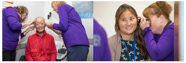 Audiologists surveying a patient's ear
