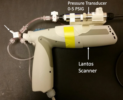 Scanner with pressure transducer coupled to absorbing medium fluid reservoir