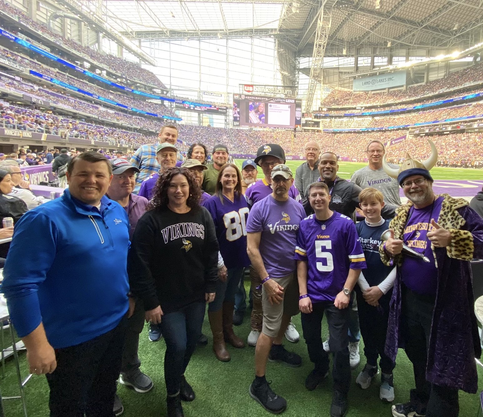 Starkey employees on the Vikings football field.