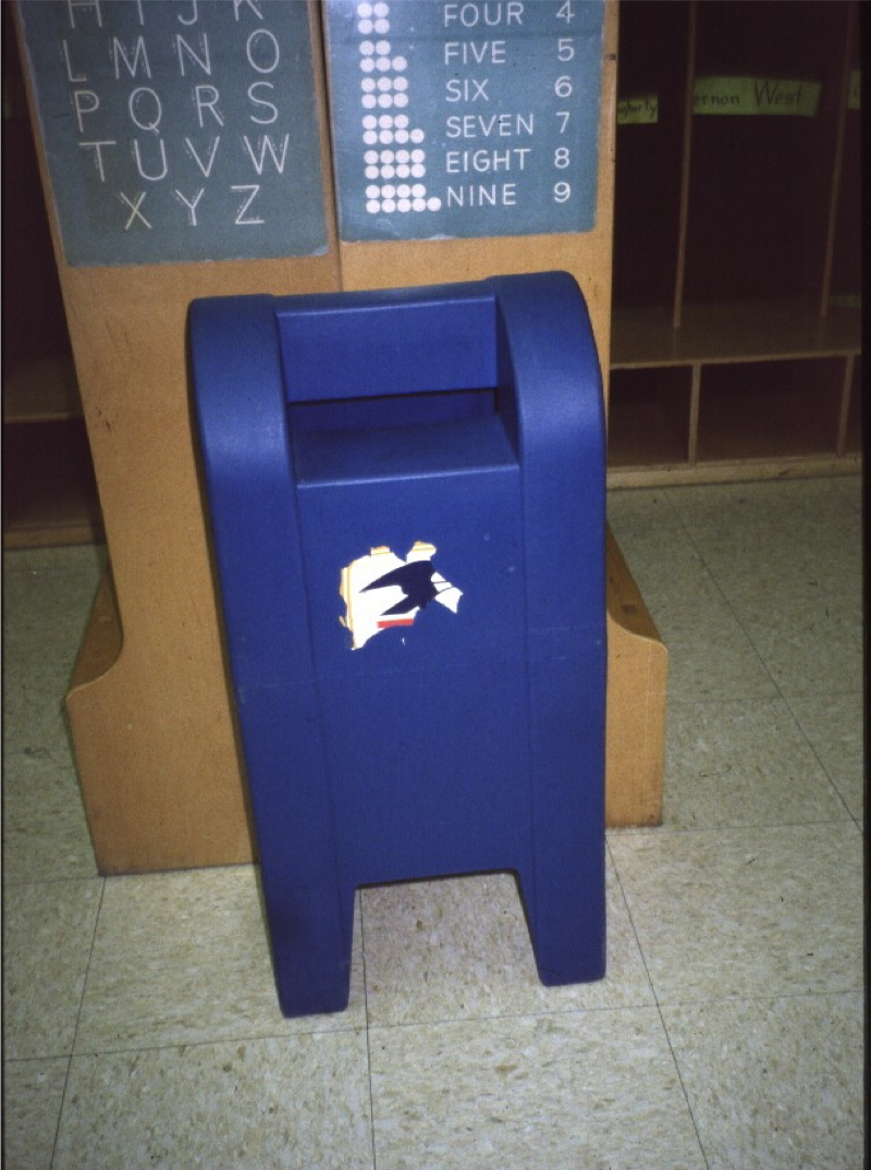 Toy blue US mailbox for affirmation notes