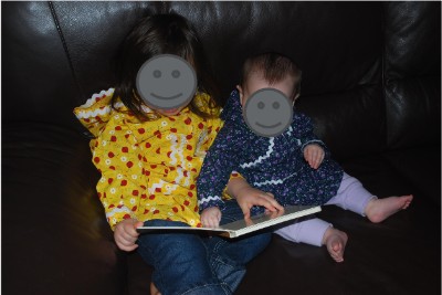 Children looking at a book.