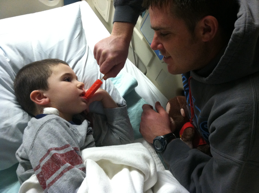 Author's husband and son at bedside