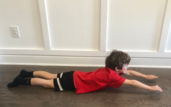 Exercises for the Landau reflex with child in prone keeping legs on ground