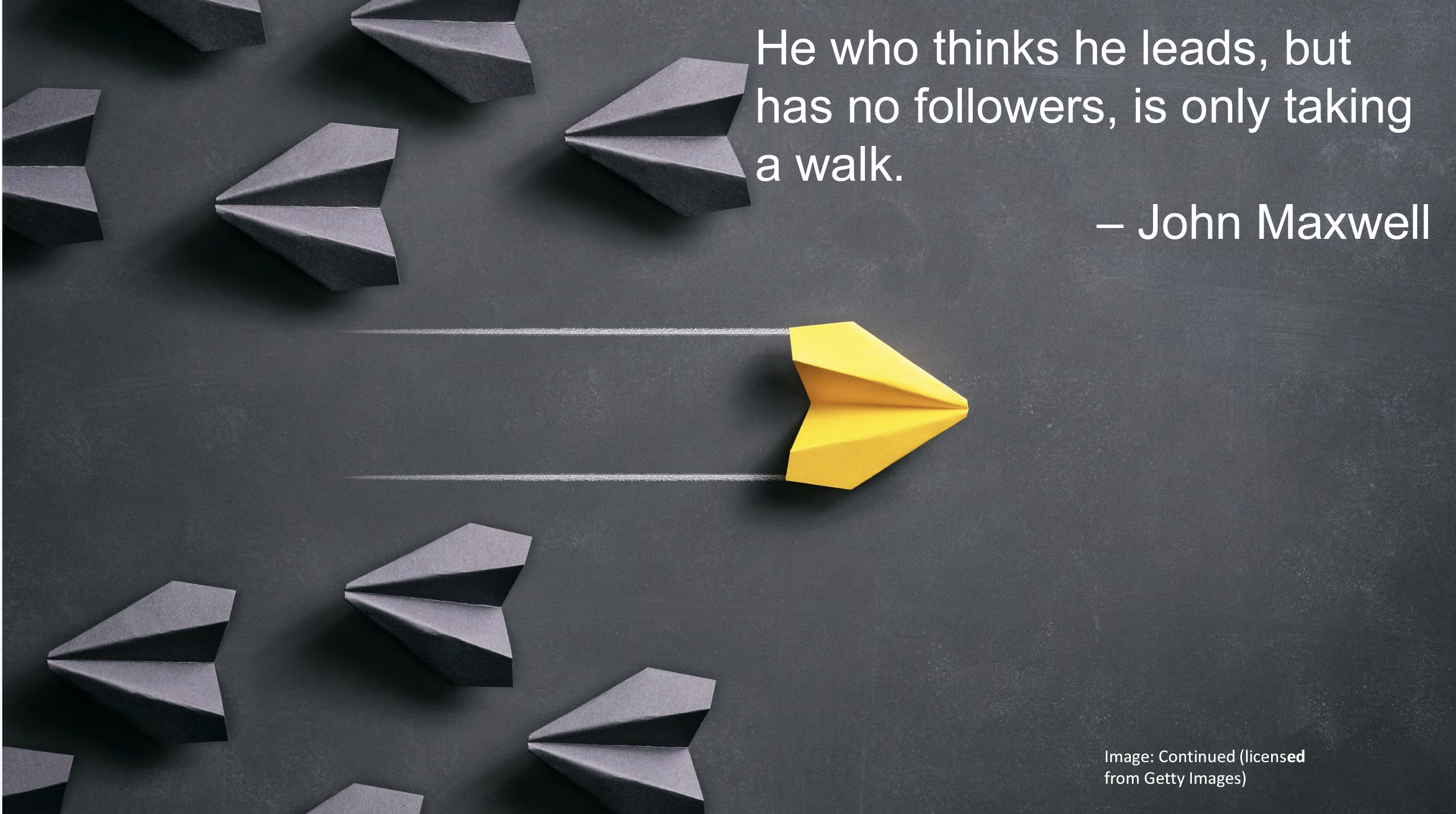 Grey paper airplanes heading left and one yellow paper airplane heading right