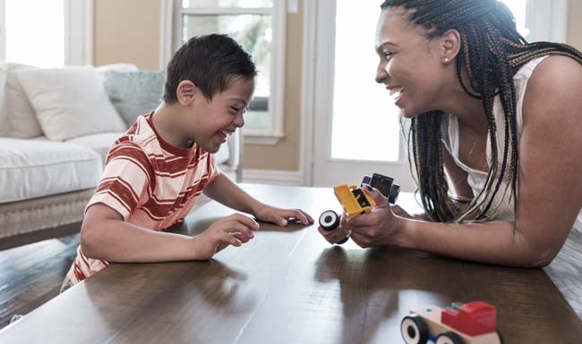 speech pathologist playing with child and toys