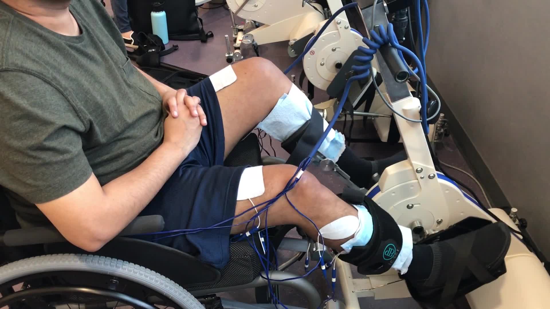 Video of client with electrical stimulation on a bike