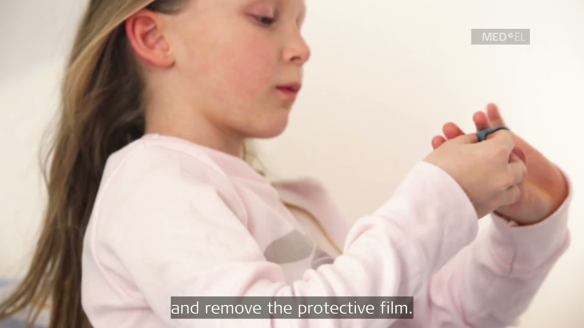 Screenshot from a video demonstrating how to use and handle the ADHEAR system