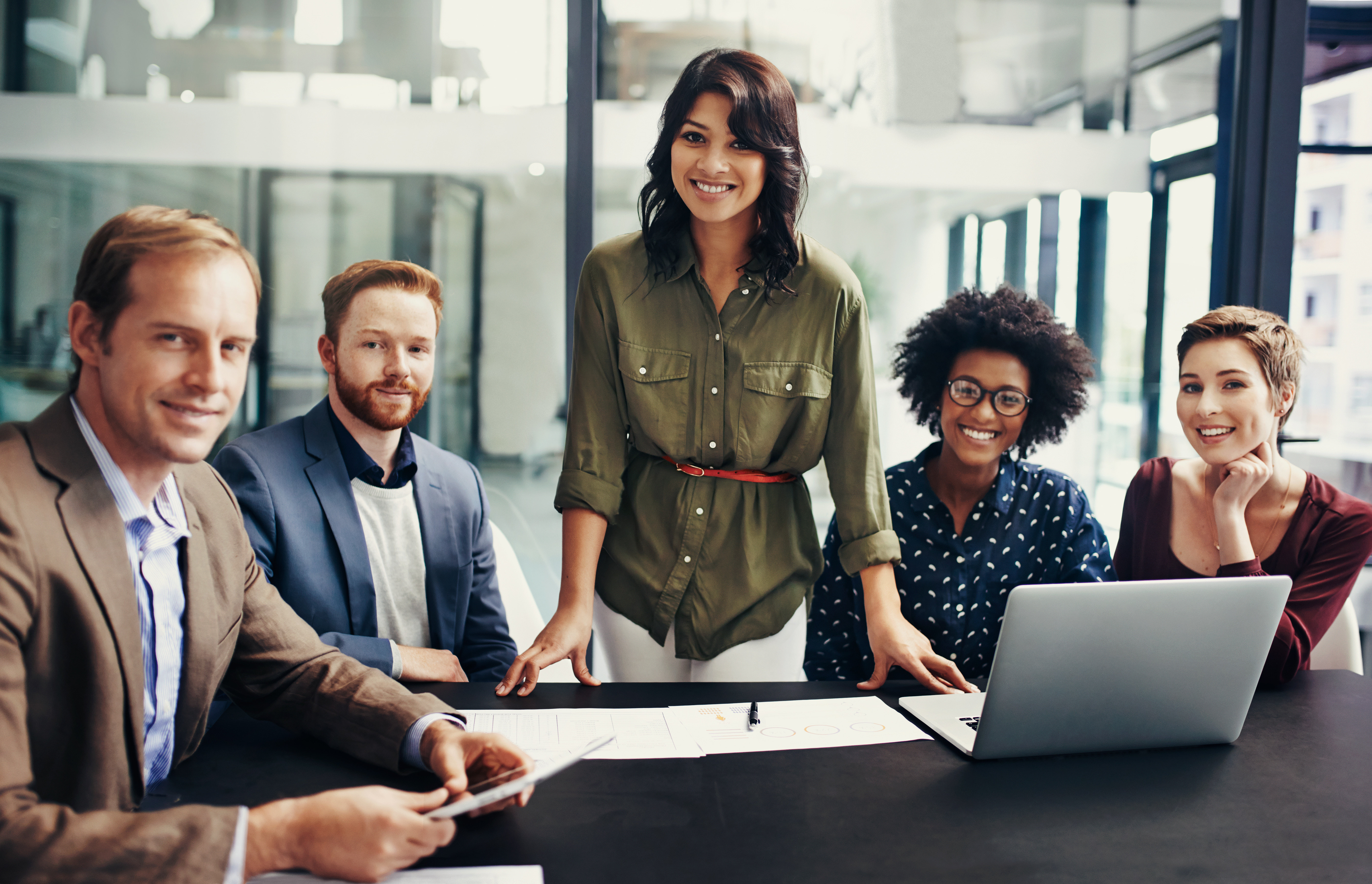 Several people sitting at a conference table